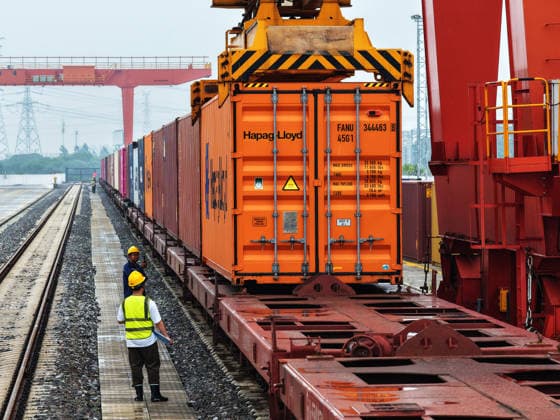 YANGZHOU, CHINA - JULY 04: A freight train loads containers at a logistics base on the Jiangdu railway dedicated line on July 4, 2026 in Yangzhou, Jiangsu Province of China. China s state railway completed a freight volume of over 2 billion tons in the first half of 2026.  Copyright: xVCGx 111652158887