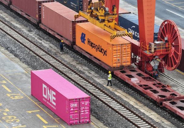 YANGZHOU, CHINA - JULY 04: A freight train loads containers at a logistics base on the Jiangdu railway dedicated line on July 4, 2026 in Yangzhou, Jiangsu Province of China. China s state railway system completed a freight volume of over 2 billion tons in the first half of 2026.  Copyright: xVCGx 111652158888
