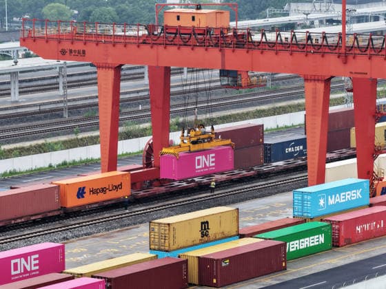 YANGZHOU, CHINA - JULY 04: A freight train loads containers at a logistics base on the Jiangdu railway dedicated line on July 4, 2026 in Yangzhou, Jiangsu Province of China. China s state railway system completed a freight volume of over 2 billion tons in the first half of 2026.  Copyright: xVCGx 111652158889