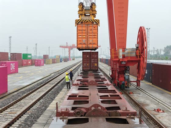 YANGZHOU, CHINA - JULY 04: Freight trains load containers at the Jiangdu railway dedicated line logistics base on July 4, 2026 in Yangzhou, Jiangsu Province of China. China s state railway system completed a freight volume of over 2 billion tons in the first half of 2026.  Copyright: xVCGx 111652158884