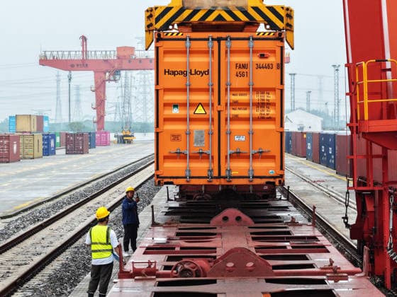 YANGZHOU, CHINA - JULY 04: A freight train loads containers at the Jiangdu railway special line logistics base on July 4, 2026 in Yangzhou, Jiangsu Province of China. China s state railway system completed a total freight volume exceeding 2 billion tons in the first half of 2026.  Copyright: xVCGx 111652158885