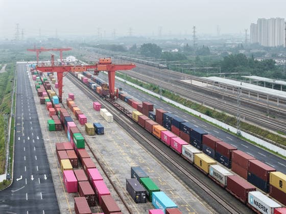 YANGZHOU, CHINA - JULY 04: Freight trains load containers at the Jiangdu railway dedicated line logistics base on July 4, 2026 in Yangzhou, Jiangsu Province of China. China s state railway system completed a freight volume exceeding 2 billion tons in the first half of 2026.  Copyright: xVCGx 111652158876