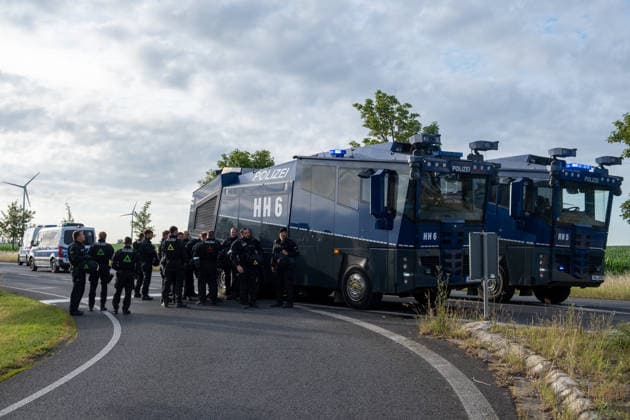 Mass demonstrations accompany AfD party congress in eastern Germany ERFURT, GERMANY - JULY 4: Protesters block the roads leading to the Messe Erfurt exhibition grounds during demonstrations against the federal party congress of the Alternative for Germany (AfD) in Erfurt, Germany, on July 4, 2026. Around 8:30 a.m., demonstrators established approximately nine coordinated blockades, occupying all major access routes to the congress venue in an attempt to prevent AfD delegates from reaching the event. More than police officers were deployed to secure the congress, clear blockades and maintain access to the venue. The AfD is a right-wing populist political party whose positions on immigration and national identity have made it one of Germany s  Copyright: x2026xAnadoluxMouafakxMahmaljix