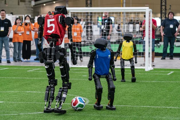 RoboCup 2026 in Incheon, South Korea - 04 Jul 2026 Humanoid robots play soccer during the Humanoid soccer league at Songdo ConvensiA. RoboCup 2026 INCHEON is happening from July 2 to July 6 at Songdo ConvensiA. The event was first held in 1997 and is the world’s largest robot soccer competition and a global challenge dedicated to build a better future through artificial intelligence and robotic technologies. Incheon South Korea Copyright: xSimonxShinx xSOPAxImagesx _DSC5405