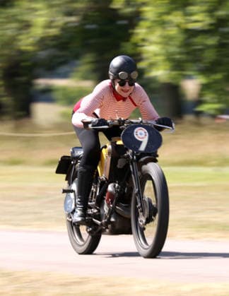 Judy Westacott on a Scott Flying Squirrel as The Vintage Speed Trials event is taking place at Grimsthorpe Castle in Lincolnshire. Featuring vintage cars and motorcycles it attracts hundreds of people to show off their vehicles, and many wear attire from the pre-war period. Vintage Speed Trials, Grimsthorpe Castle, Lincolnshire, on 4th July, 2026.  .