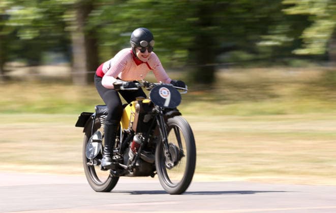 Judy Westacott on a Scott Flying Squirrel as The Vintage Speed Trials event is taking place at Grimsthorpe Castle in Lincolnshire. Featuring vintage cars and motorcycles it attracts hundreds of people to show off their vehicles, and many wear attire from the pre-war period. Vintage Speed Trials, Grimsthorpe Castle, Lincolnshire, on 4th July, 2026.  .