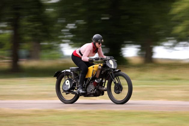 Judy Westacott on a Scott Flying Squirrel as The Vintage Speed Trials event is taking place at Grimsthorpe Castle in Lincolnshire. Featuring vintage cars and motorcycles it attracts hundreds of people to show off their vehicles, and many wear attire from the pre-war period. Vintage Speed Trials, Grimsthorpe Castle, Lincolnshire, on 4th July, 2026.  .