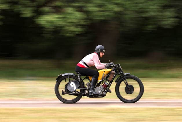 Judy Westacott on a Scott Flying Squirrel as The Vintage Speed Trials event is taking place at Grimsthorpe Castle in Lincolnshire. Featuring vintage cars and motorcycles it attracts hundreds of people to show off their vehicles, and many wear attire from the pre-war period. Vintage Speed Trials, Grimsthorpe Castle, Lincolnshire, on 4th July, 2026.  .