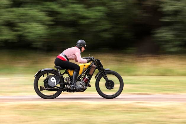 Judy Westacott on a Scott Flying Squirrel as The Vintage Speed Trials event is taking place at Grimsthorpe Castle in Lincolnshire. Featuring vintage cars and motorcycles it attracts hundreds of people to show off their vehicles, and many wear attire from the pre-war period. Vintage Speed Trials, Grimsthorpe Castle, Lincolnshire, on 4th July, 2026.  .