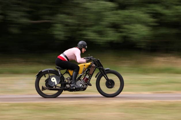 Judy Westacott on a Scott Flying Squirrel as The Vintage Speed Trials event is taking place at Grimsthorpe Castle in Lincolnshire. Featuring vintage cars and motorcycles it attracts hundreds of people to show off their vehicles, and many wear attire from the pre-war period. Vintage Speed Trials, Grimsthorpe Castle, Lincolnshire, on 4th July, 2026.  .