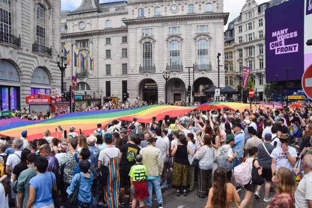 July 4, 2026, London, England, United Kingdom: Participants pass with a giant Pride flag through Piccadilly Circus during the Pride In London parade. London United Kingdom - ZUMAv130 20260704_zip_v130_010 Copyright: xVukxValcicx