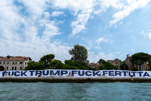 News Themen der Woche KW27 News Bilder des Tages Reportage - Protest against U.S.A ambassador Tilman J. Fertitta and Donald Trump Protesters unfurl a banner against the arrival of U.S. Ambassador Tilman J. Fertitta, scheduled for July 17. Venice, Italy, 04 07 2026 during Protest against U.S.A ambassador Tilman J. Fertitta and Donald Trump, Reportage in Venice, Italy, July 04 2026 Venice Venice Biennale Italy Copyright: xLeonardoxGaravagliax xLiveMediax LPN_2549166