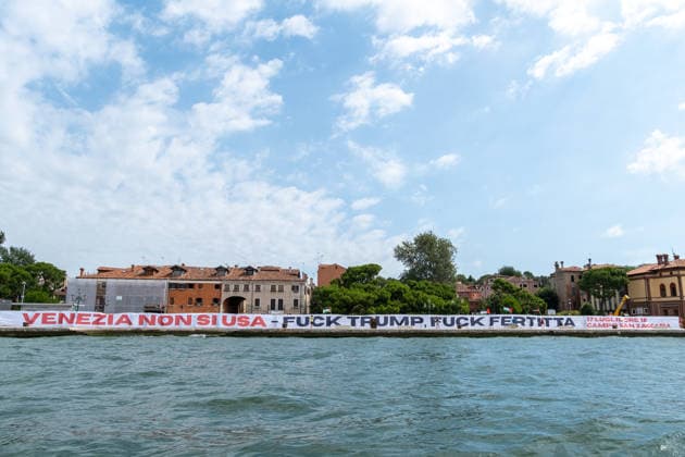 Reportage - Protest against U.S.A ambassador Tilman J. Fertitta and Donald Trump Protesters unfurl a banner against the arrival of U.S. Ambassador Tilman J. Fertitta, scheduled for July 17. Venice, Italy, 04 07 2026 during Protest against U.S.A ambassador Tilman J. Fertitta and Donald Trump, Reportage in Venice, Italy, July 04 2026 Venice Venice Biennale Italy Copyright: xLeonardoxGaravagliax xLiveMediax LPN_2549172