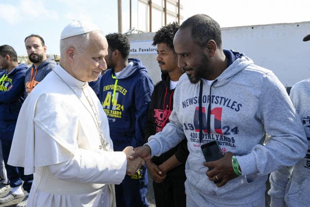 Pope Leo XIV Visits Lampedusa - Italy Pope Leo XIV meets some migrants before the celebration of a mass on the southern Italian island of Lampedusa on July 4, 2026 during a pastoral visit to the island at the crossroads of migrations routes from North Africa to Europe. Pope Leo XIV condemned the brutal treatment of migrants and refugees and the loss of life at sea, urging the world to concretely and compassionately respond to the ‘enormity of suffering’. Photo by (EV) Simone Risoluti Vatican Media ABACAPRESS.COM Lampedusa Italy  Copyright: xABACAx