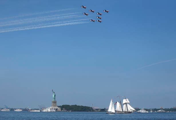 Acrobatic jets perform a flyover as tall ships sail past the Statue of Liberty as part of Sail4th 250, a celebration for America s 250th anniversary, in New York City on Saturday, July 4, 2026. The event includes over 100 tall ships and navy vessels from more than 30 nations.  NYP20260704201 JOHNxANGELILLO