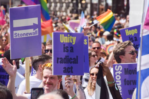 July 4, 2026, London, United Kingdom: A participant from the organisation Stonewall holds a placard stating Unity is a radical act during the Pride In London parade. London United Kingdom  - ZUMAs197 20260704_aaa_s197_068 Copyright: xVukxValcicx