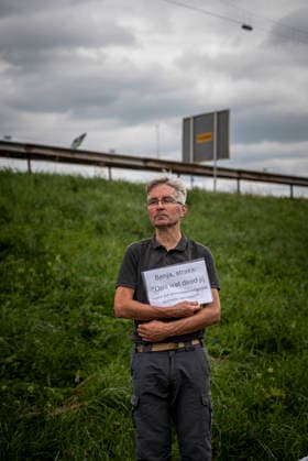 July 4, 2026, Utrecht, Utrecht, Netherlands: 4 July 2026, Utrecht, the Netherlands. A climate activist holds a sign reading Benja, later: Grandpa, what did you do about that life-destroying system back then? (translated from Dutch). Climate activists from Extinction Rebellion and Utrecht for Palestine block the A12 highway near Utrecht, Netherlands, demanding an end to billions in annual fossil fuel subsidies. Utrecht Netherlands  - ZUMAp202 20260704_zip_p202_006 Copyright: xJamesxPetermeierx