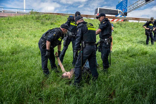 July 4, 2026, Utrecht, Utrecht, Netherlands: 4 July 2026, Utrecht, the Netherlands. Dutch police arrest climate activists attempting to block a major Dutch highway. Climate activists from Extinction Rebellion and Utrecht for Palestine block the A12 highway near Utrecht, Netherlands, demanding an end to billions in annual fossil fuel subsidies. Utrecht Netherlands  - ZUMAp202 20260704_zip_p202_012 Copyright: xJamesxPetermeierx