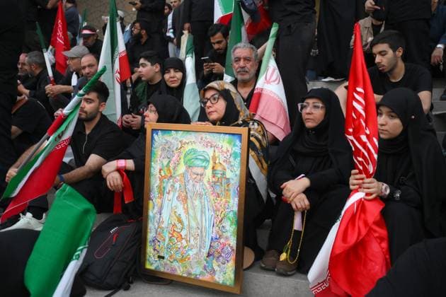 Iran Late Supreme Leader Funeral Rites 9200034 04.07.2026 People gather on the day of a public farewell ceremony to pay their respects to late Supreme Leader Ayatollah Ali Khamenei and his family members, who were killed in Israeli and U.S. airstrikes, in a square near the Imam Khomeini Mosque, also known as the Grand Mosalla Mosque, in Tehran, Iran. Ilya Pitalev Sputnik Tehran Iran  Copyright: xIlyaxPitalevx