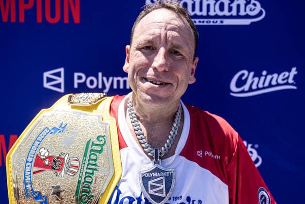 Joey Chestnut poses with his championship belt after competing in the 110th Nathan s Famous Fourth of July International Hot Dog Eating Contest on Independence Day, Saturday, July 4, 2026 on Coney Island in New York City. Joey Chestnut won the championship and retains his title eating 70 hot dogs and buns.  NYP20260704805 JONATHANxFERNANDEZ