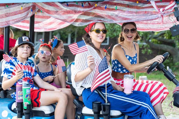 July 4, 2026, Sullivans Island, Sc, United States of America: People wave flags during the annual Bicycle and Golf cart parade celebrating the 250th Independence Day, July 4, 2026 in Sullivans Island, South Carolina. Like most of the nation, South Carolina is under a heat dome with dangerously hot, humid weather. Sullivans Island United States of America  - ZUMAe02_ 20260704_zaf_e02_042 Copyright: xRichardxEllisx