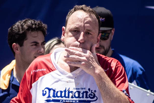 Joey Chestnut competes in the 110th Nathan s Famous Fourth of July International Hot Dog Eating Contest on Independence Day, Saturday, July 4, 2026 on Coney Island in New York City. Joey Chestnut won the championship and regains his title eating 70 hot dogs and buns.  NYP2026070480121 JONATHANxFERNANDEZ