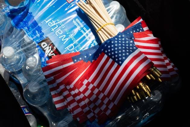 March against Trump on Independence Day in Washington, DC WASHINGTON, D.C., USA JULY 4, 2026: Bottled water and American flags are distributed to participants during the We The People 250 march in Washington, D.C., on July 4, 2026. The demonstration protested what organizers described as abuses of power by U.S. President Donald Trump and his administration. The march concluded earlier than planned due to record high temperatures in the U.S. capital. WASHINGTON, D.C. DC United States of America Copyright: x xAllisonxBaileyx xJNAxPressx