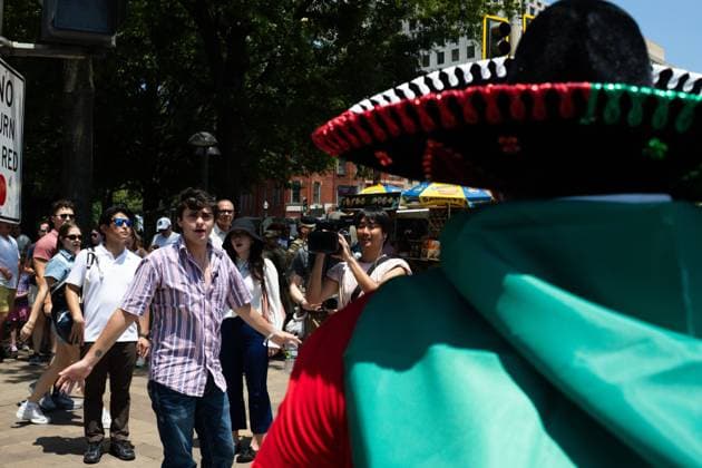 March against Trump on Independence Day in Washington, DC WASHINGTON, D.C., USA JULY 4, 2026: Trump supporters heckle a man wearing a mariachi sombrero and Mexican flag at We The People 250, a march against abuse of power by U.S. President Donald Trump and his administration. The march ended early due to record heat in the nation™s capital. WASHINGTON, D.C. DC United States of America Copyright: x xAllisonxBaileyx xJNAxPressx
