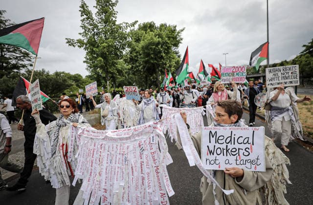 July 4, 2026, Berlin, Berlin, Germany: Berlin, Germany, July 4, 2026: Demonstrators take part in a pro-Palestinian march through central Berlin calling for an end to the war in Gaza, protection of medical workers, and the release of detained Palestinian doctor Hussam Abu Safiya. Participants carried Palestinian flags, banners and photographs during the demonstration. ZUMA Press Wire. Berlin Germany  - ZUMAa268 20260704_zip_a268_001 Copyright: xAbdelrahmanxAlkahloutx