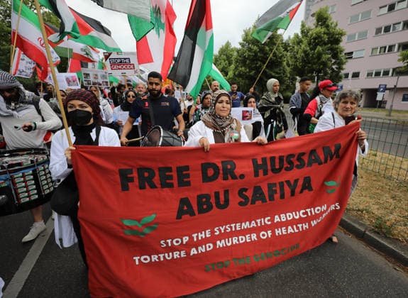 July 4, 2026, Berlin, Berlin, Germany: Berlin, Germany, July 4, 2026: Demonstrators take part in a pro-Palestinian march through central Berlin calling for an end to the war in Gaza, protection of medical workers, and the release of detained Palestinian doctor Hussam Abu Safiya. Participants carried Palestinian flags, banners and photographs during the demonstration. ZUMA Press Wire. Berlin Germany  - ZUMAa268 20260704_zip_a268_004 Copyright: xAbdelrahmanxAlkahloutx
