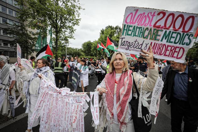 July 4, 2026, Berlin, Berlin, Germany: Berlin, Germany, July 4, 2026: Demonstrators take part in a pro-Palestinian march through central Berlin calling for an end to the war in Gaza, protection of medical workers, and the release of detained Palestinian doctor Hussam Abu Safiya. Participants carried Palestinian flags, banners and photographs during the demonstration. ZUMA Press Wire. Berlin Germany  - ZUMAa268 20260704_zip_a268_007 Copyright: xAbdelrahmanxAlkahloutx