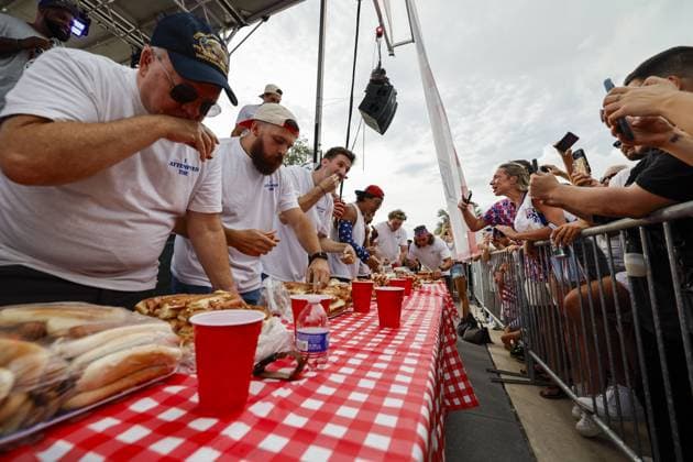 July 4, 2026, Tampa, Florida, USA: 20 contestants compete to a crowd of hundreds at the Where my Dogs at? Hot Dog Eating Contest at Armature Works part of the Liberty By The Bay citywide celebration on Saturday, July 4, 2026 in Tampa. Tampa USA  - ZUMAs70_ 20260704_zan_s70_004 Copyright: xLuisxSantanax