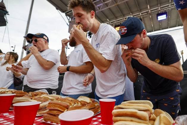 July 4, 2026, Tampa, Florida, USA: Contestants compete to a crowd of hundreds at the Where my Dogs at? Hot Dog Eating Contest at Armature Works part of the Liberty By The Bay citywide celebration on Saturday, July 4, 2026 in Tampa. Tampa USA  - ZUMAs70_ 20260704_zan_s70_008 Copyright: xLuisxSantanax