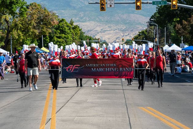 July 4, 2026, Provo, Utah, USA: Members of a high school marching band dressed in maroon and black uniforms play brass instruments while marching down the street during America s Freedom Festival Grand Parade in Provo, Utah, Saturday, July 4, 2026. The annual Independence Day event features expanded programming to honor the 250th anniversary of United States independence. Provo USA - ZUMAm292 20260704_znp_m292_032 Copyright: xCharlesxMcClintockxWilsonx