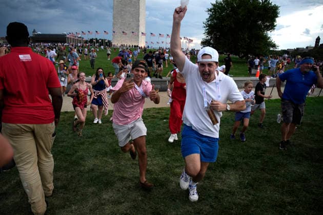 250th Independence Day Celebration evacuation - Washington Attendees run back to heir seats after thinking evacuate was canceled the Fourth of July celebrations marking the 250th anniversary of U.S. Independence due to the threat of sever weather near Washington Monument in Washington on July 4, 2026. Photo by Yuri Gripas ABACAPRESS.COM Washington DC United States  Copyright: xGripasxYuri ABACAx