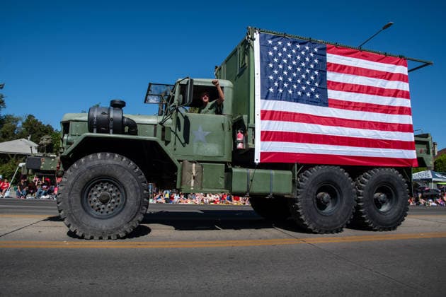 July 4, 2026, Provo, Utah, USA: A vintage military cargo truck draped with a large American flag drives along the route during America s Freedom Festival Grand Parade in Provo, Utah, Saturday, July 4, 2026. The annual Independence Day event features expanded programming to honor the 250th anniversary of United States independence. Provo USA - ZUMAm292 20260704_znp_m292_052 Copyright: xCharlesxMcClintockxWilsonx