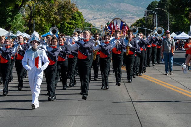 July 4, 2026, Provo, Utah, USA: Members of a high school marching band dressed in maroon and black uniforms play brass instruments while marching down the street during America s Freedom Festival Grand Parade in Provo, Utah, Saturday, July 4, 2026. The annual Independence Day event features expanded programming to honor the 250th anniversary of United States independence. Provo USA - ZUMAm292 20260704_znp_m292_063 Copyright: xCharlesxMcClintockxWilsonx