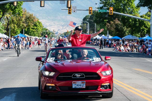 July 4, 2026, Provo, Utah, USA: A red convertible car carrying parade participants drives down the street during America s Freedom Festival Grand Parade in Provo, Utah, Saturday, July 4, 2026. The annual event drew thousands of spectators to the downtown corridor. Provo USA - ZUMAm292 20260704_znp_m292_080 Copyright: xCharlesxMcClintockxWilsonx