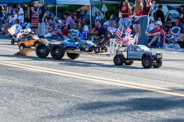 July 4, 2026, Provo, Utah, USA: A remote-controlled pickup truck decorated with small American flags tows a trailer carrying a second RC vehicle down the street during America s Freedom Festival Grand Parade in Provo, Utah, Saturday, July 4, 2026. The annual Independence Day event features expanded programming to honor the 250th anniversary of United States independence. Provo USA - ZUMAm292 20260704_znp_m292_125 Copyright: xCharlesxMcClintockxWilsonx