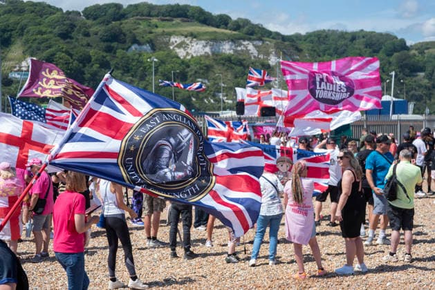 Far-right demo and antifascist counter-protest in Dover, UK - 04 Jul 2026 Far-right protesters hold flags during a demonstration outside the Immigration Centre in Dover. Around 100-120 supporters of the Pink Ladies gathered from across the country in Dover, UK. The Pink Ladies is an anti immigration far-right movement. The far-right activists marched through central Dover to the Immigration Centre and they were confronted by a small group of antifascist counter-protesters during their march. Dover United Kingdom Copyright: xKrisztianxElekx xSOPAxImagesx SSS_20260704_FAR_RIGHT_0011005064