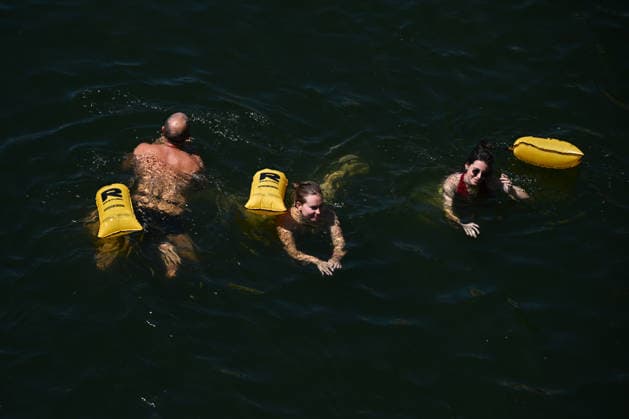 (260705) -- PARIS, July 5, 2026 -- People swim in the Seine River, Paris, France, on July 4, 2026. Paris opened some swimming sites in the Seine River to help people escape heat on Saturday. (Photo by Xinhua) FRANCE-PARIS-SEINE RIVER-SWIMMING-OPEN EmmaxDaxSilva 