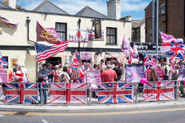 July 4, 2026, Dover, United Kingdom: Far-right protesters gather by the Golden Lion pub before a demonstration in Dover. Around 100-120 supporters of the Pink Ladies gathered from across the country in Dover, UK. The Pink Ladies is an anti immigration far-right movement. The far-right activists marched through central Dover to the Immigration Centre and they were confronted by a small group of antifascist counter-protesters during their march. Dover United Kingdom  - ZUMAs197 20260704_aaa_s197_225 Copyright: xKrisztianxElekx