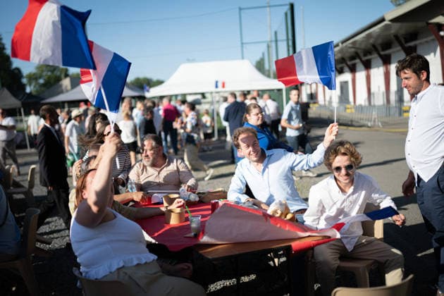 Marine Le Pen and Jordan Bardella at the RN party event La fete champetre - Lievin AJ This photo is an illustration of a participant holds French flags during a RN party event La fete champetre in Lievin, northern France on July 4, 2026. Photo by Alexis Jumeau ABACAPRESS.COM. Paris France  Copyright: xJumeauxAlexis ABACAx