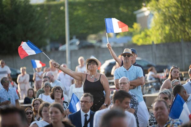 Marine Le Pen and Jordan Bardella at the RN party event La fete champetre - Lievin AJ This photo is an illustration of a participant holds French flags during a RN party event La fete champetre in Lievin, northern France on July 4, 2026. Photo by Alexis Jumeau ABACAPRESS.COM. Paris France  Copyright: xJumeauxAlexis ABACAx