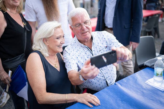 Marine Le Pen and Jordan Bardella at the RN party event La fete champetre - Lievin AJ President of Rassemblement National parliamentary group Marine Le Pen reacts and takes selfies with supporters (supporter) during a RN party event La fete champetre in Lievin, northern France on July 4, 2026. Photo by Alexis Jumeau ABACAPRESS.COM. Paris France  Copyright: xJumeauxAlexis ABACAx