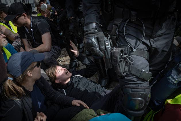 Protest against the federal party conference of the Alternative for Germany (AfD) in Erfurt - 04 Jul 2026 A protester lies on the ground next to a police officer during the demonstrations against the federal party conference of the Alternative for Germany (AfD). The party’s two-day convention is being held at the Erfurt Exhibition Centre on July 4–5. According to police, around 31,000 people took part in the protests, while organizers estimated attendance at about 50,000. Demonstrators held marches, rallies and blockades of several access roads, including a section of the A71 motorway. Erfurt Germany Copyright: xVasilyxKrestyaninovx xSOPAxImagesx _VKR2439