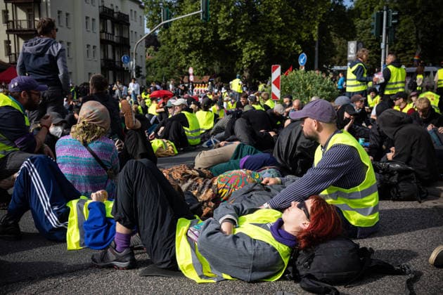 July 4, 2026, Erfurt, Germany: A protester lies on a road while blocking traffic during the demonstration against the federal party conference of the Alternative for Germany (AfD). The party™s two-day convention is being held at the Erfurt Exhibition Centre on July 4 5. According to police, around 31,000 people took part in the protests, while organizers estimated attendance at about 50,000. Demonstrators held marches, rallies and blockades of several access roads, including a section of the A71 motorway. Erfurt Germany  - ZUMAs197 20260704_aaa_s197_255 Copyright: xVasilyxKrestyaninovx