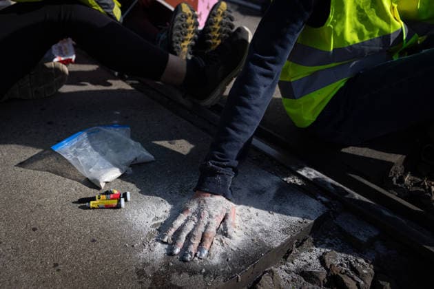July 4, 2026, Erfurt, Germany: Protesters glue their hands to the asphalt to block a road during the demonstration against the federal party conference of the Alternative for Germany (AfD). The party™s two-day convention is being held at the Erfurt Exhibition Centre on July 4 5. According to police, around 31,000 people took part in the protests, while organizers estimated attendance at about 50,000. Demonstrators held marches, rallies and blockades of several access roads, including a section of the A71 motorway. Erfurt Germany  - ZUMAs197 20260704_aaa_s197_264 Copyright: xVasilyxKrestyaninovx