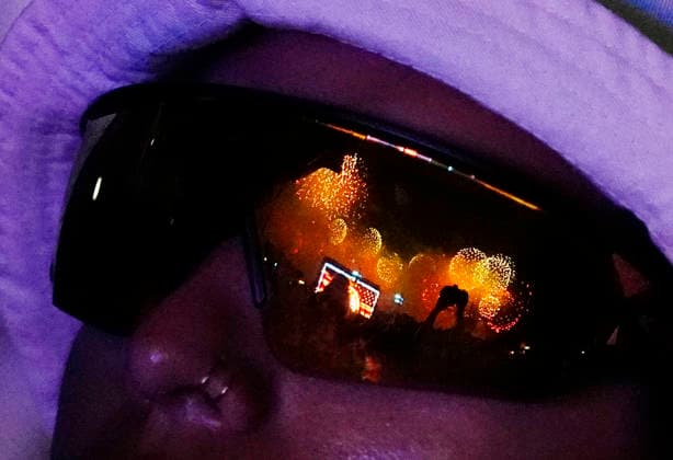 Fireworks are reflected in sunglasses as they light up the night sky over the National Mall as part of the America 250 celebrations in Washington DC on Saturday, July 4, 2026. The 35 minute July 4 fireworks show will feature 850,000 fireworks and pyrotechnic effects.  WAP20260704931 BONNIExCASH