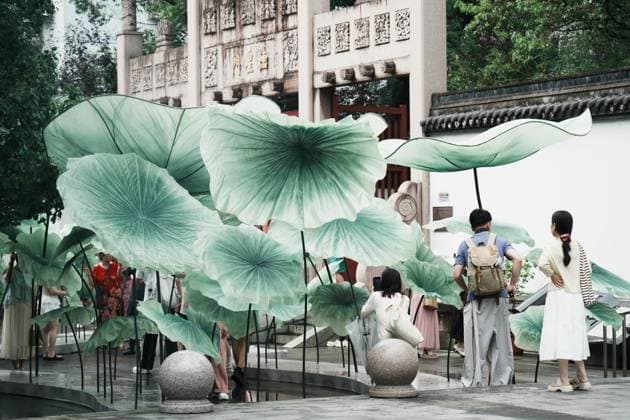 Lotus Leaf Art Installation Citizens enjoy the cool breeze under an art installation composed of giant lotus leaves in Hangzhou, Zhejiang Province, China on July 5, 2026. Hangzhou Zhejiang China  Copyright: xLWx i1783267418400